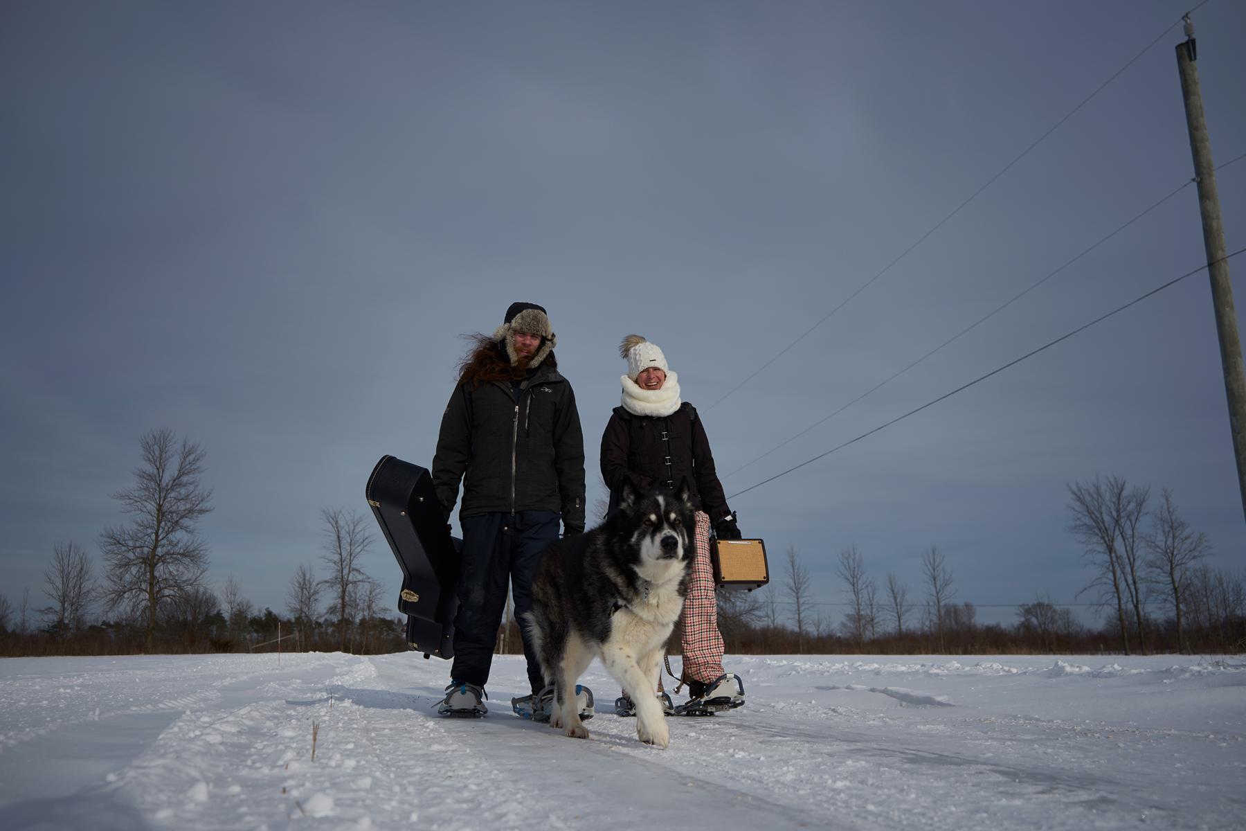 Jenn Matt and Shadow walking in snowy field