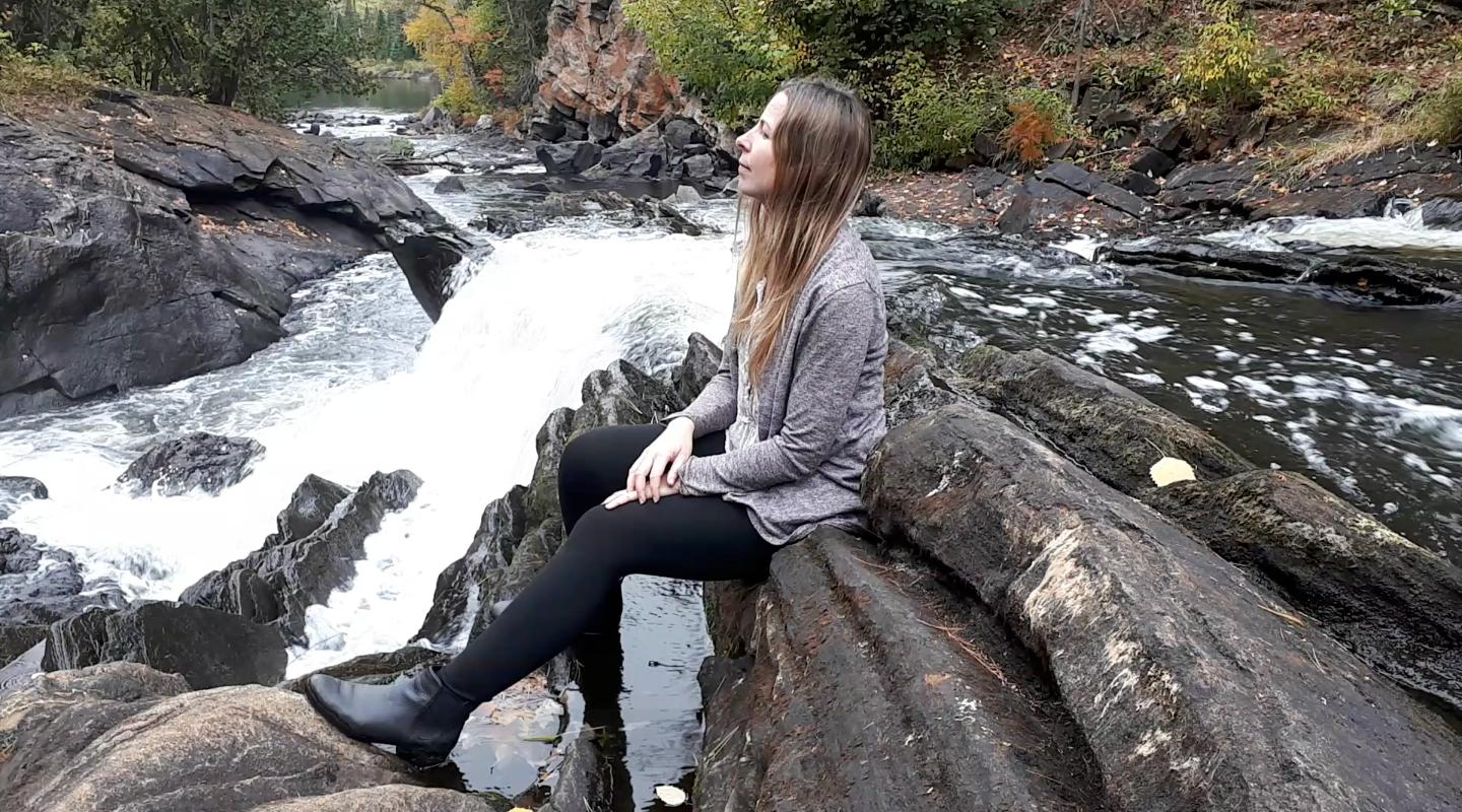 Jenn surrounded by moving water